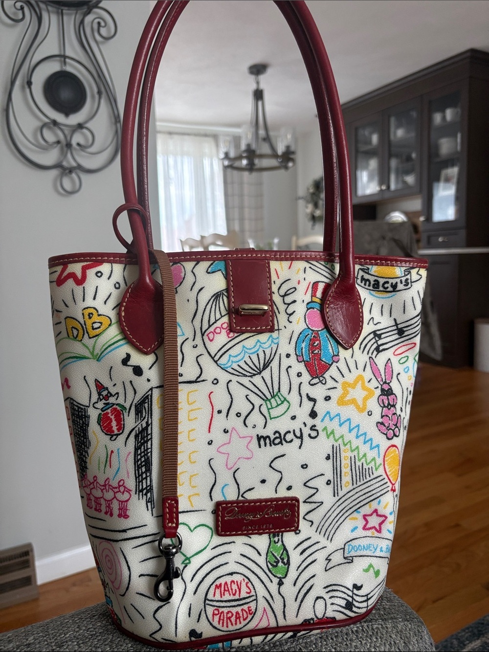 Dooney & Bourke White Canvas Tote with Red Trim and Multicolor Parade Print